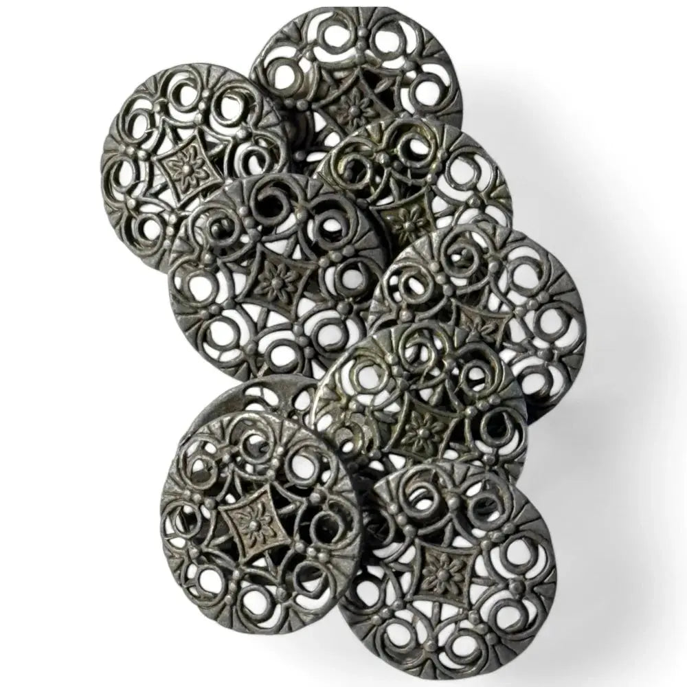 Ornate metal filigree buttons.