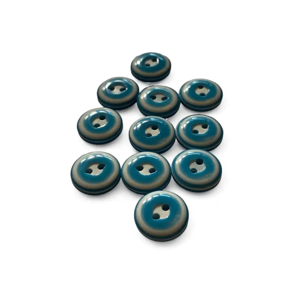 Teal and beige two-hole buttons.