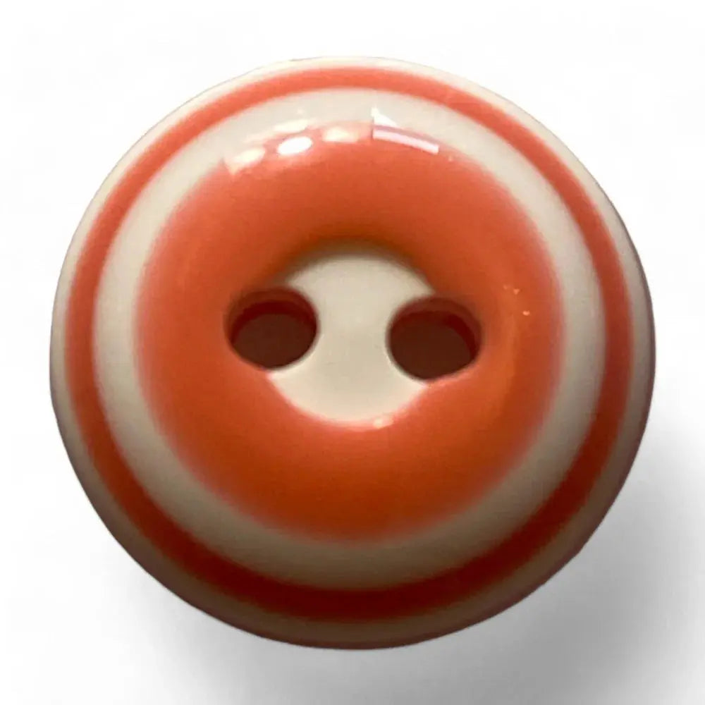 Striped orange and white button.