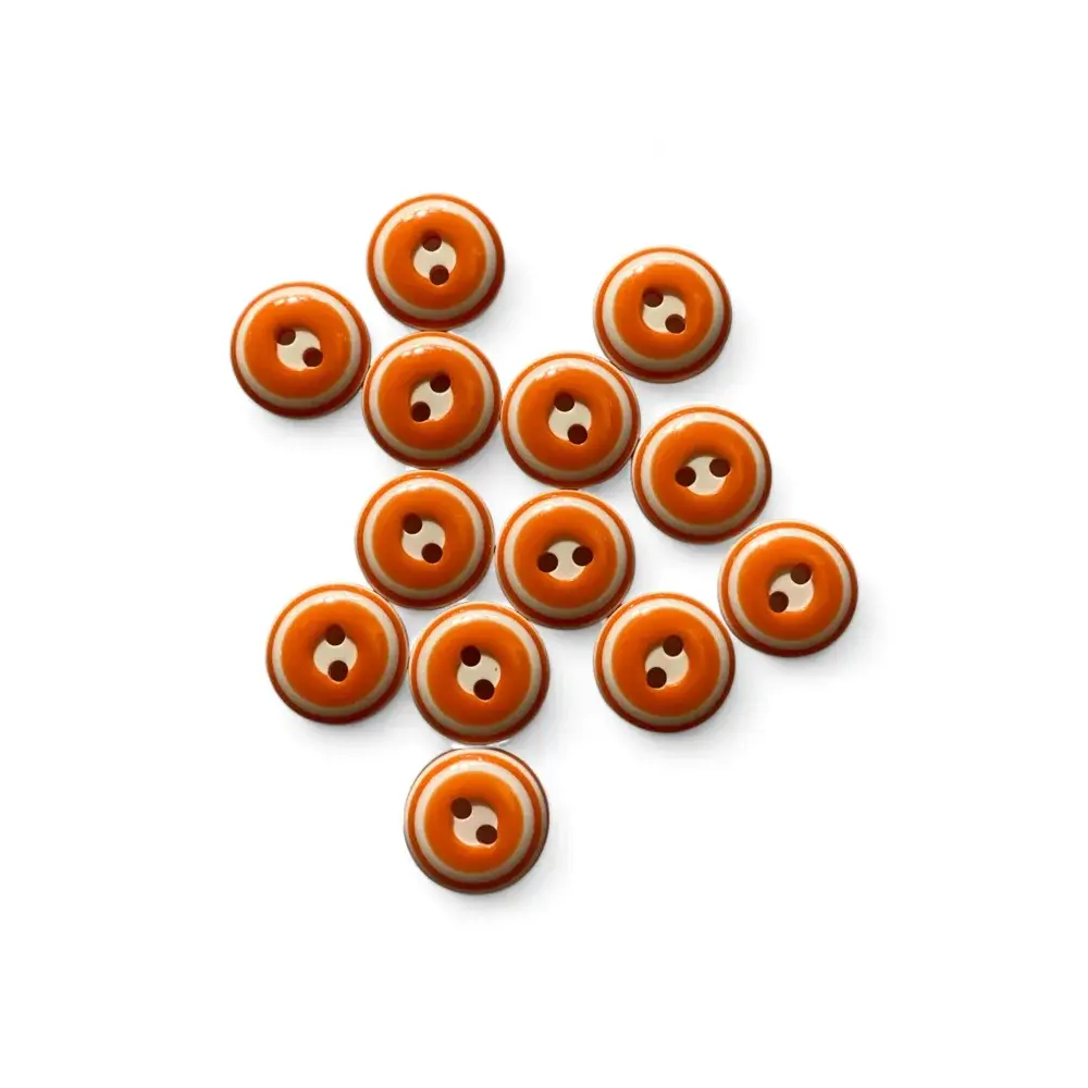 Orange and white two-hole buttons.