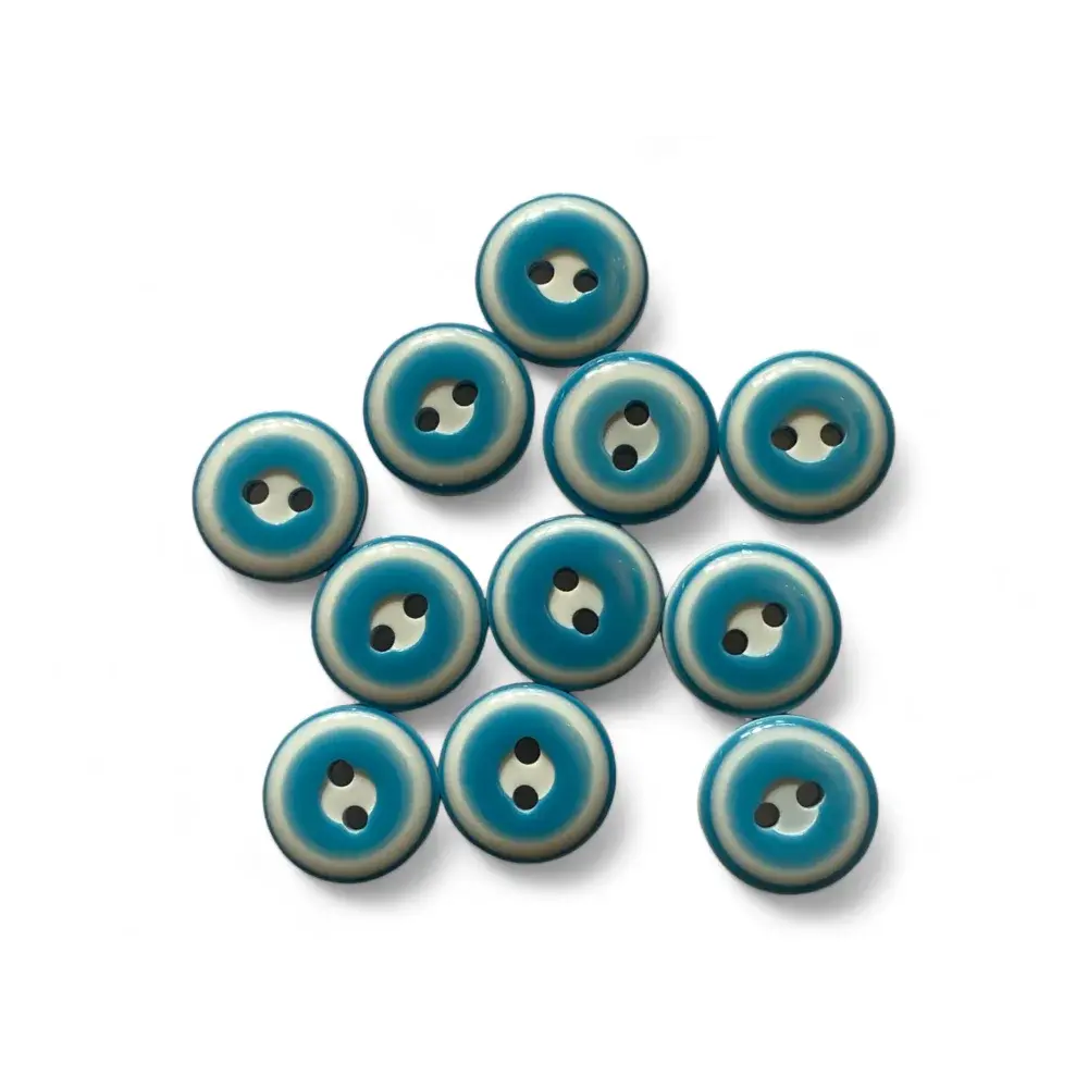 Collection of blue and white buttons.