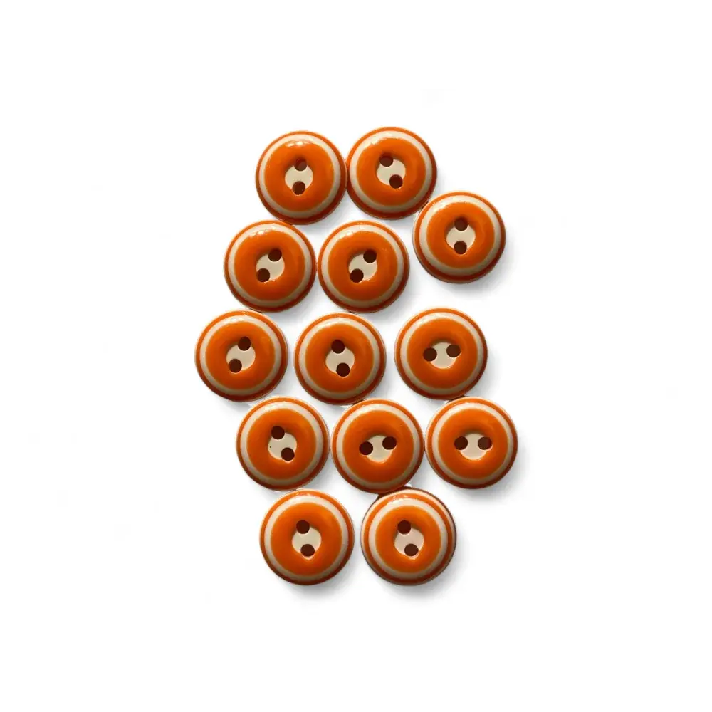 Orange and white two-hole buttons.