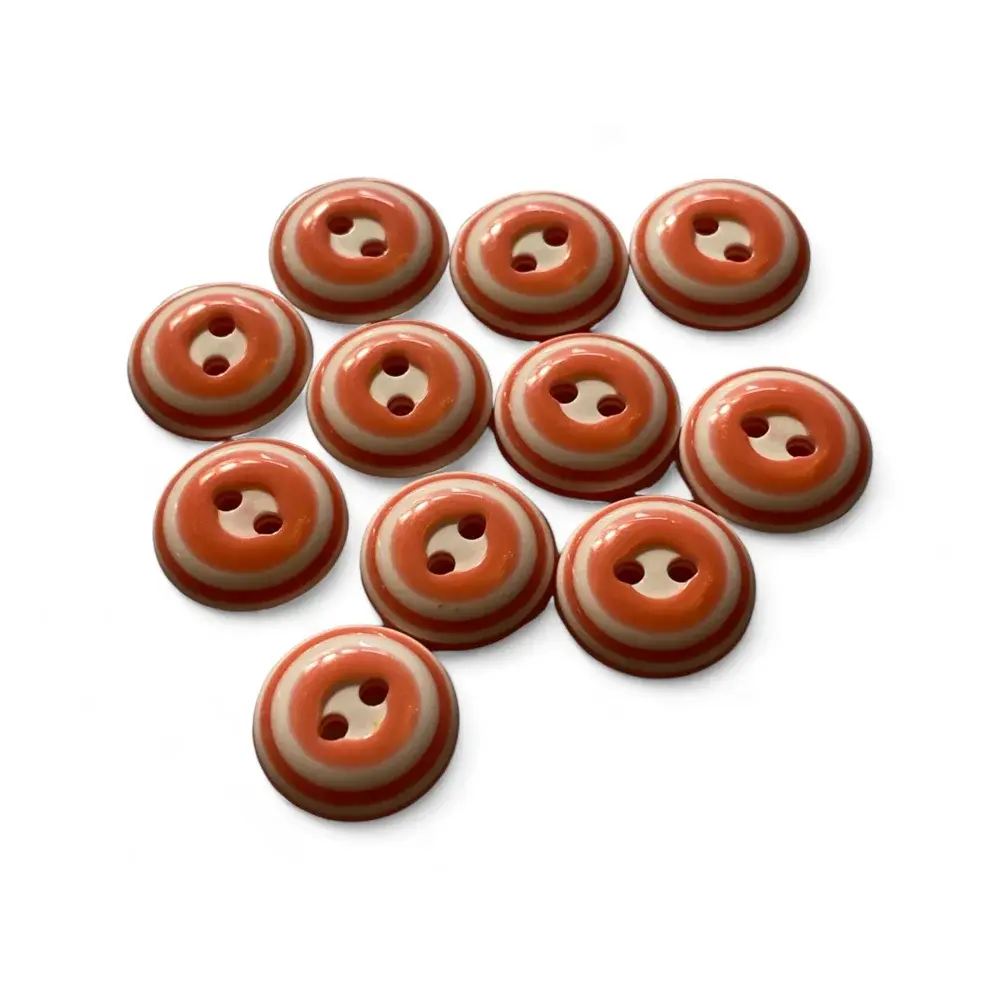 Striped orange and white buttons.