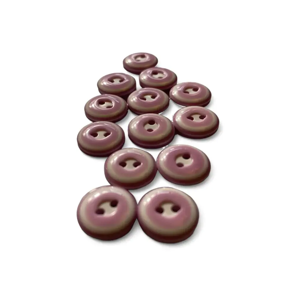 Collection of mauve buttons.