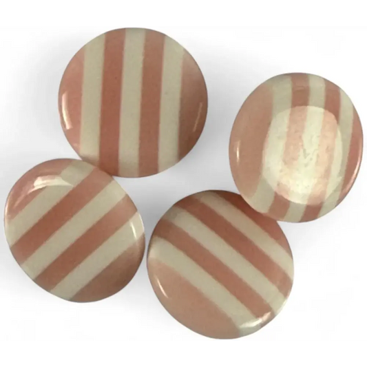 Four striped pink and white candies.