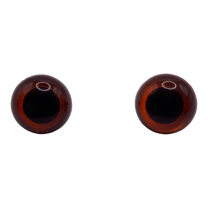 Two brown doll eyes.