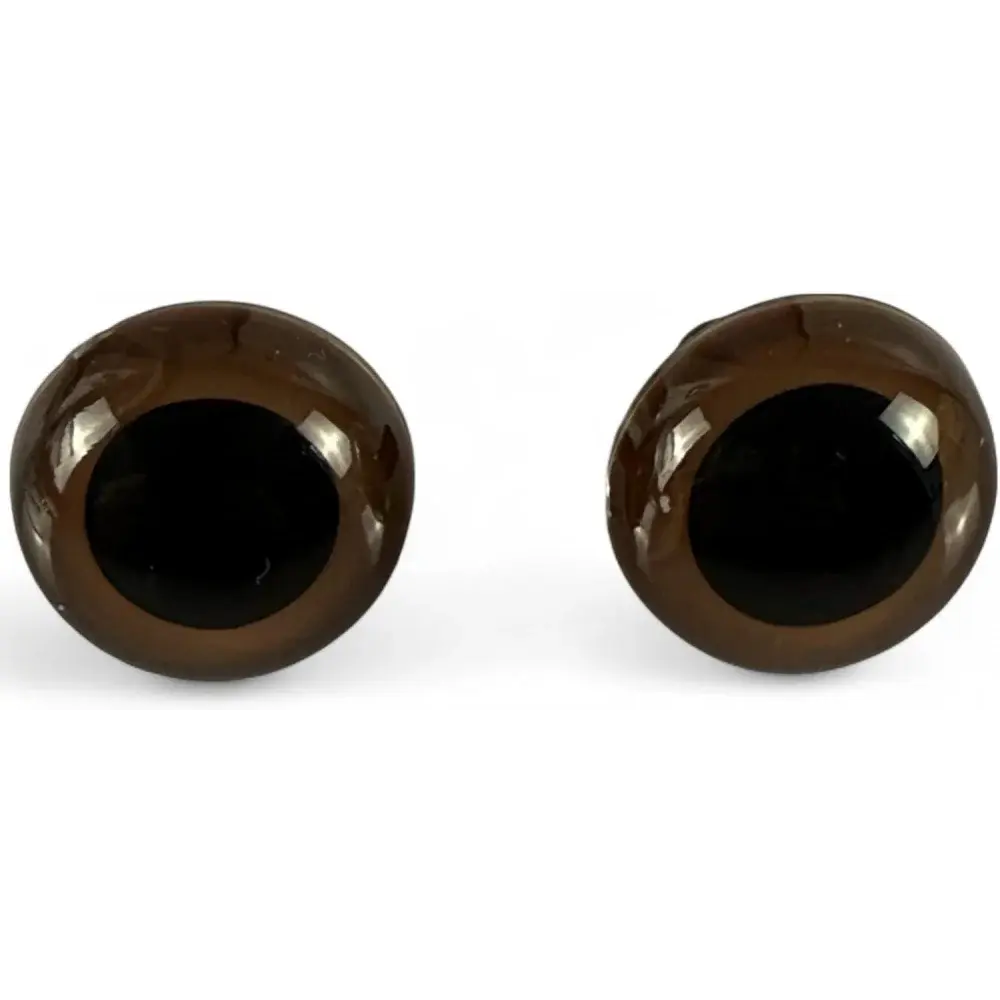 Pair of brown doll eyes.