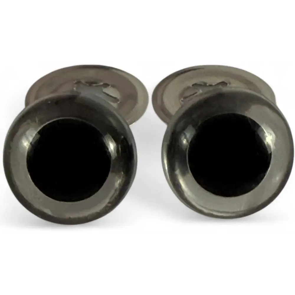 Pair of dark, round cufflinks.