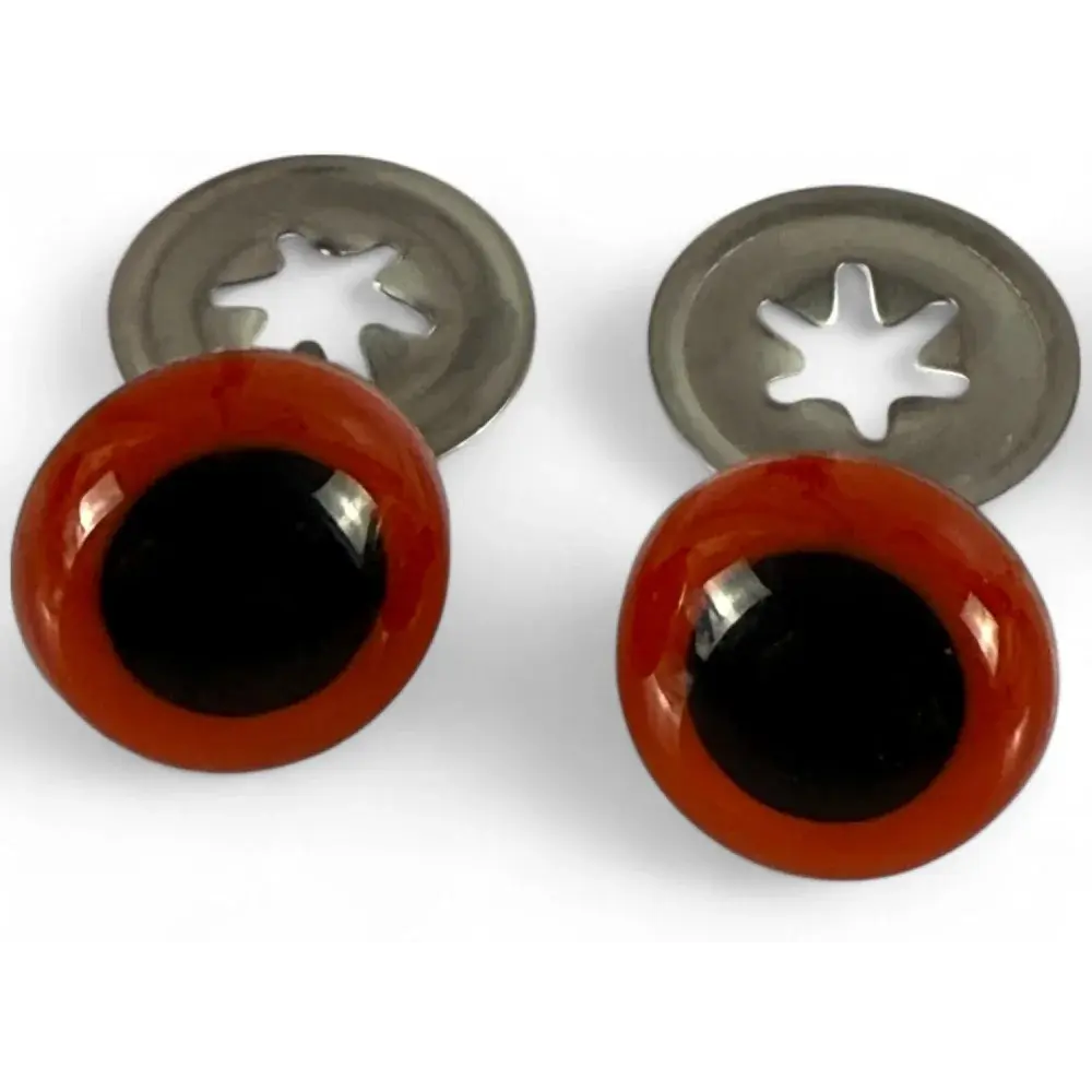 Two brown safety eyes with metal washers.