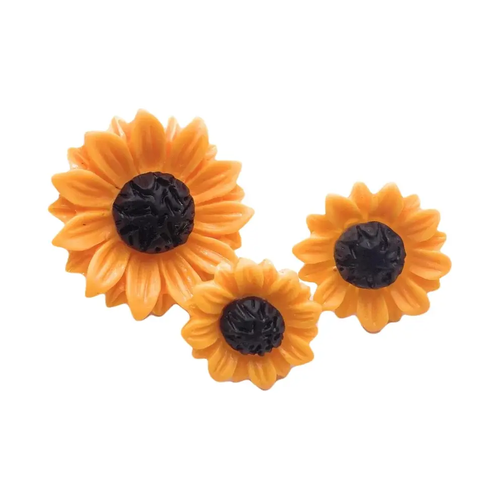 Three orange sunflower decorations.