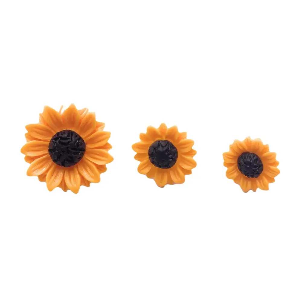 Three sunflower-shaped candles.