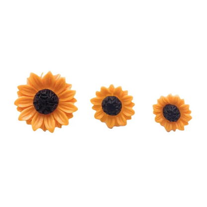 Three sunflower-shaped candles.