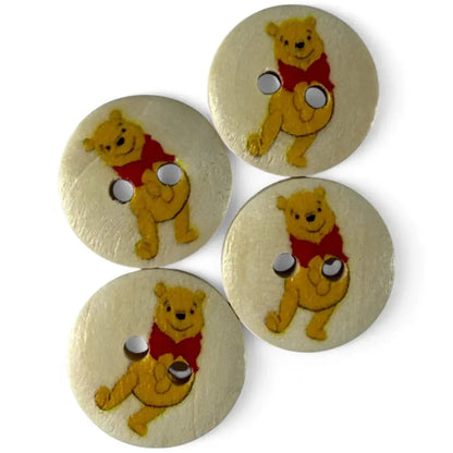 Four Winnie-the-Pooh buttons.