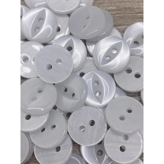 Pile of white two-hole buttons.