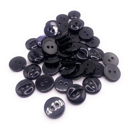 Pile of black two-hole buttons.