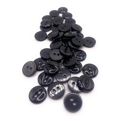 Pile of shiny black buttons.
