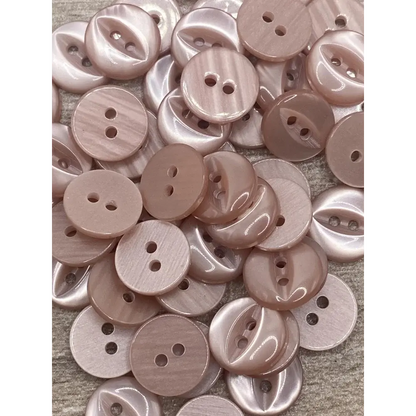 Pile of pink two-hole buttons.