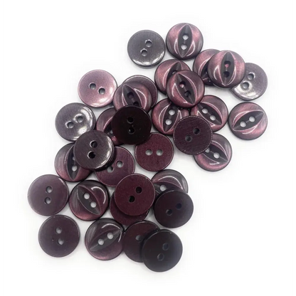 Pile of two-hole purple buttons.