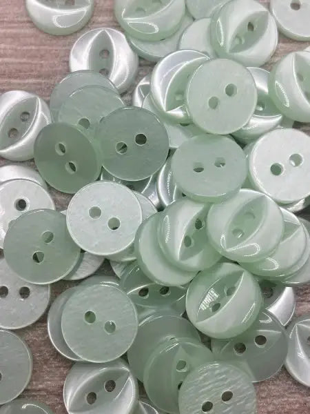 Pale green two-hole buttons.