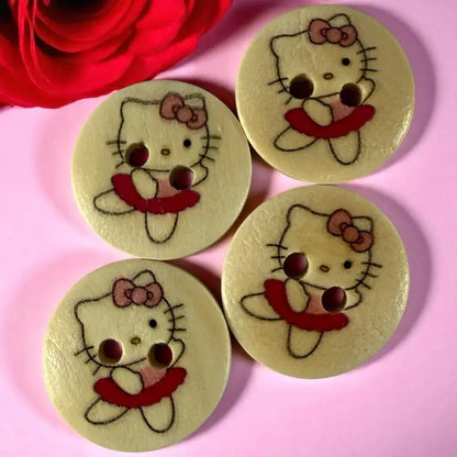 Four Hello Kitty buttons.