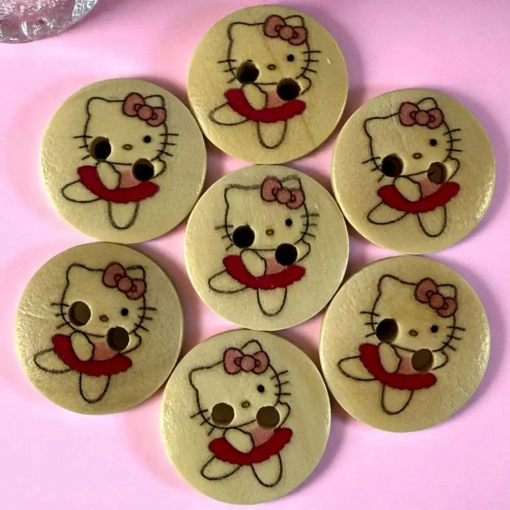 Seven Hello Kitty wooden buttons.