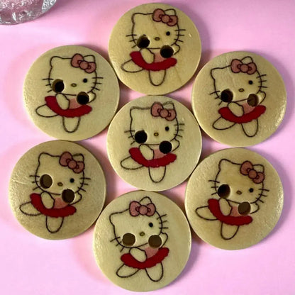 Seven Hello Kitty wooden buttons.