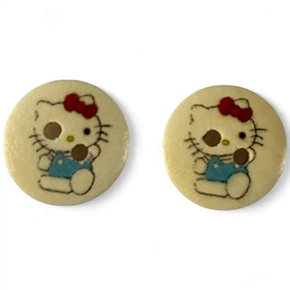 Two Hello Kitty buttons.