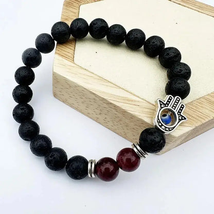 Black lava bead bracelet with Hamsa charm.