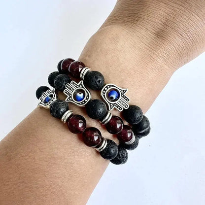 Three beaded Hamsa bracelets.
