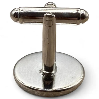 Silver-toned cufflink with toggle closure.