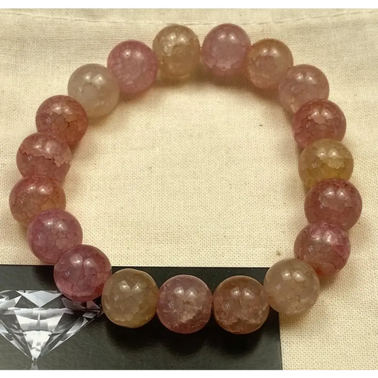 Pink and yellow beaded bracelet.