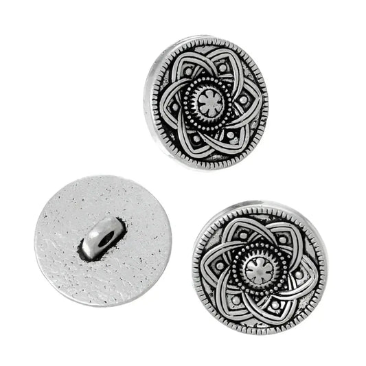 Three silver-toned decorative buttons.