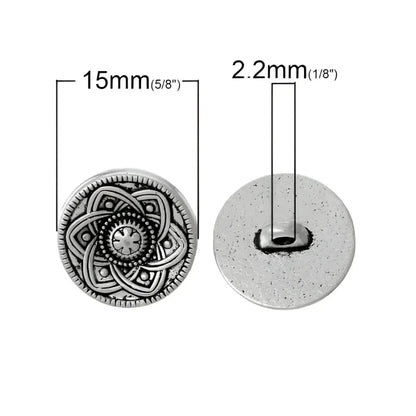 Silver-toned patterned shank button.