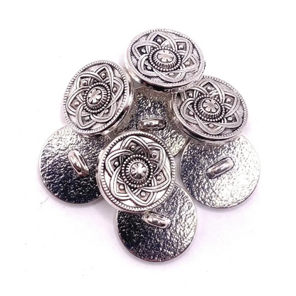 Silver decorative shank buttons.