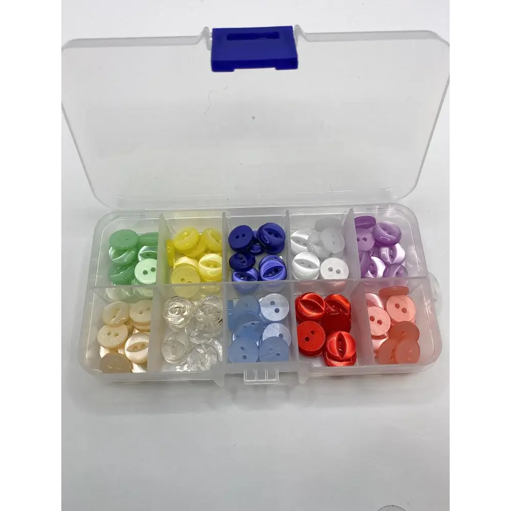 Compartmentalized box of colorful buttons.