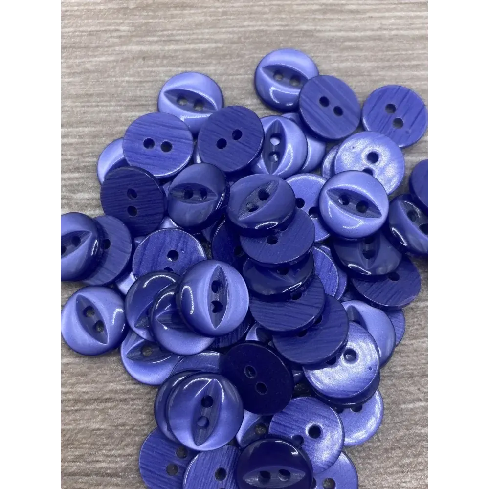 Pile of two-hole purple buttons.