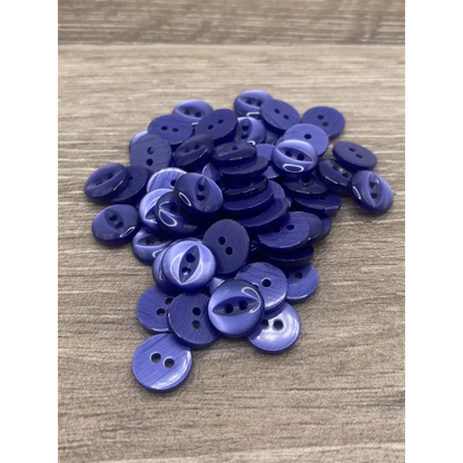 Pile of two-hole purple buttons.