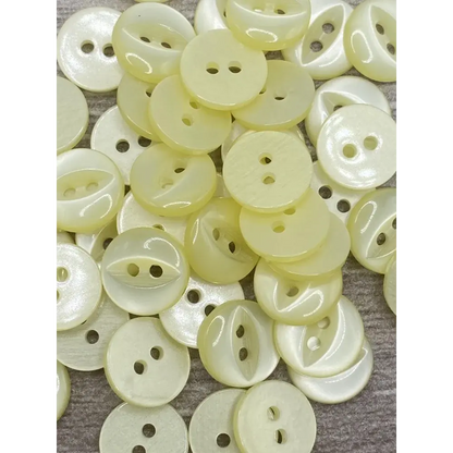Pile of pale yellow buttons.