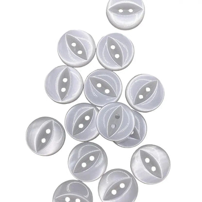 Pile of white, round, two-hole buttons.