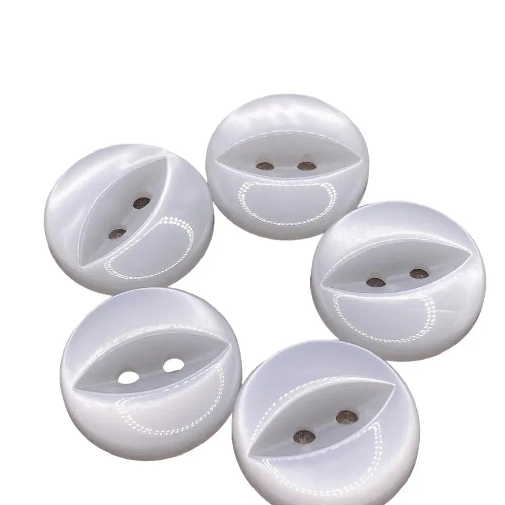 Five white, round, two-hole buttons.