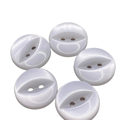 Five white, round, two-hole buttons.