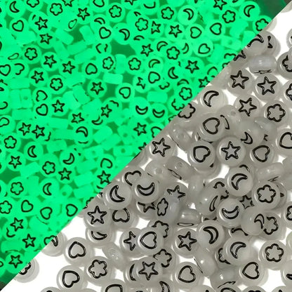 Glow-in-the-dark beads with star, moon, heart, and flower designs.