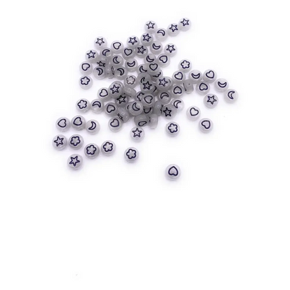 Scattered white beads with black symbols.