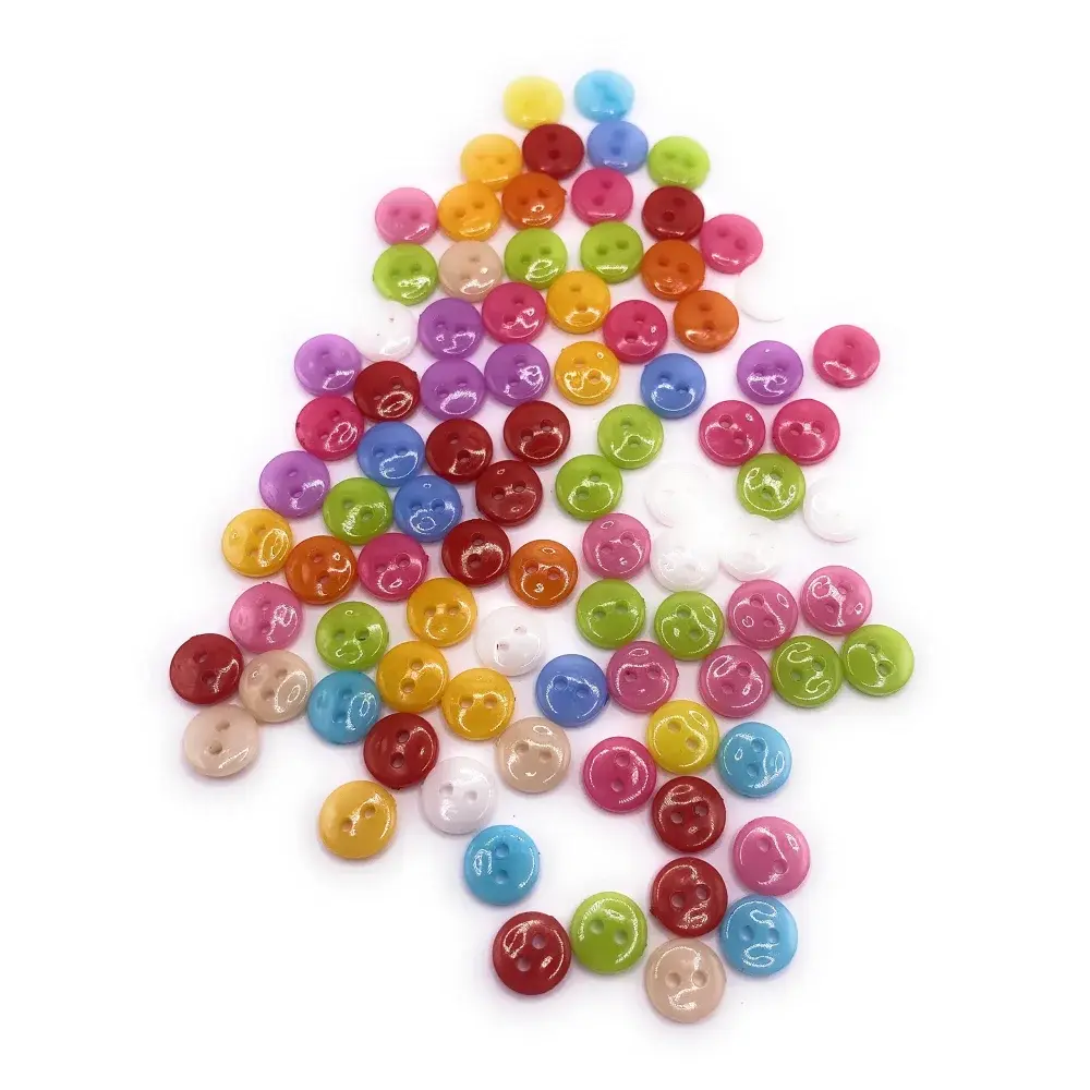 Colorful pile of small, shiny buttons.