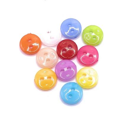 Colorful plastic two-hole buttons.