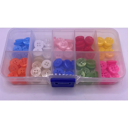 Compartmentalized box of colorful buttons.