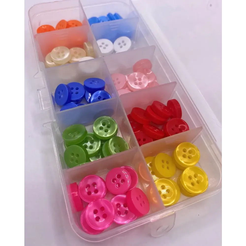 Colorful buttons in a plastic organizer.