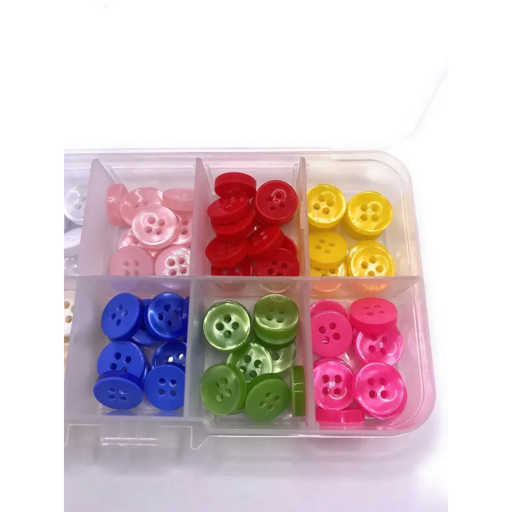 Compartmentalized box of colorful buttons.