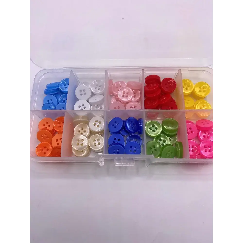 Colorful assortment of buttons in a plastic organizer.
