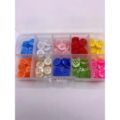 Colorful assortment of buttons in a plastic organizer.